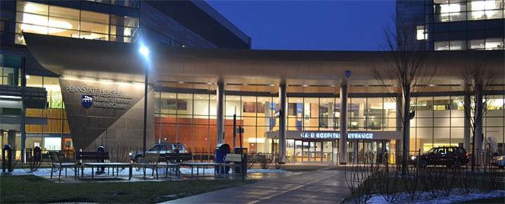 Exterior of Penn State Health Milton S. Hershey Medical Center entrance at night.