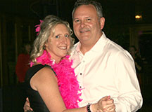 Kathy and her husband celebrating at her 50 shades of pink party.